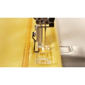 Permatoma pėdelė plokščiasiūlei mašinai